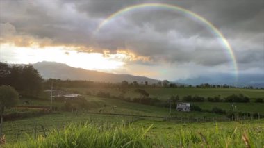 Animated Rainbow Over the Plains Under Overcast Sky