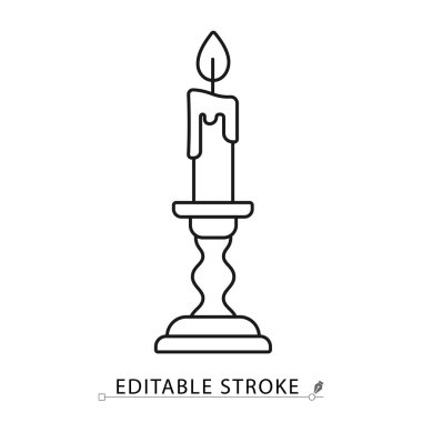 A candle in a candlestick icon in a minimalist line style with editable stroke. Vintage light source, halloween decoration, magic ritual object, spooky horror illumination, retro decor