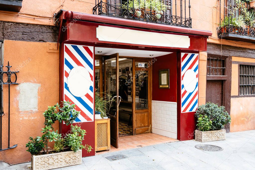 Madrid, Spain - June 2, 2018: Old Barber shop in Cuchilleros Street in city centre of Madrid near Plaza Mayor