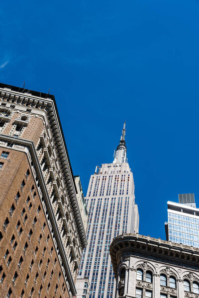 Low angle view of buildings against sky in Midtown of Manhattan in New York