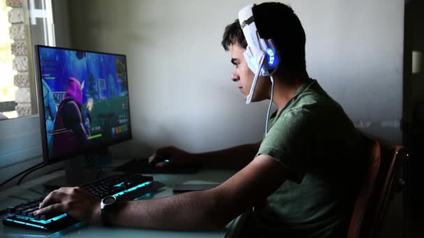 teenager playing fortnite video game stock footage - fortnite teenager