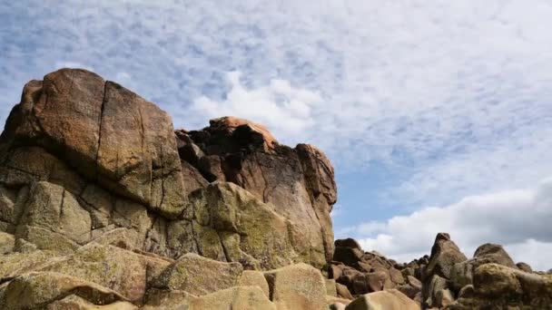 Time Lapse of rocks against clouds moving in Sillon of Tallbert — Stock Video
