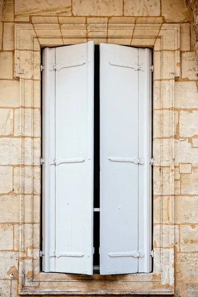 Old window with wooden white painted shutters — Stock Photo, Image