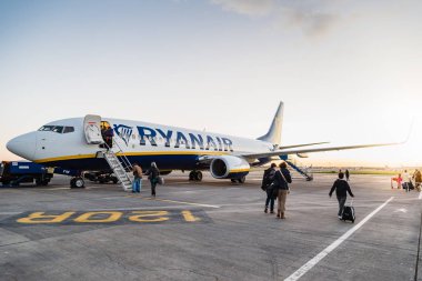 Passengers boarding on Ryanair Boeing 737-800 airplane  clipart