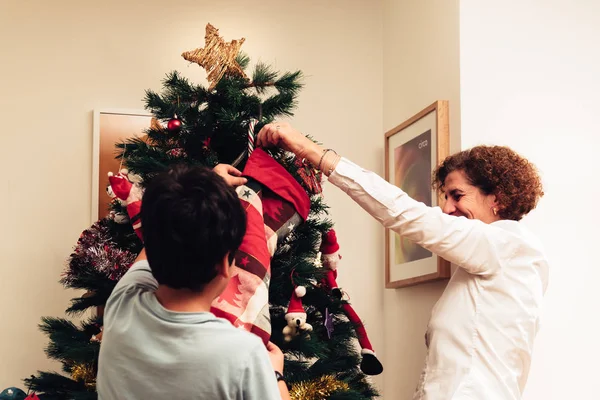 Family at Christmas tree