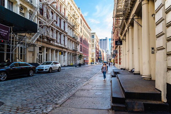 New York City, USA - June 25, 2018: Greene Street with luxury fashion retail stores in Soho Cast Iron historic District in New York City.