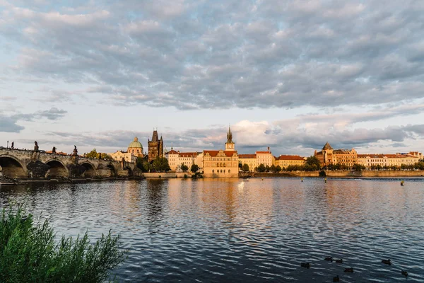 Charles Bridge in Prague against sky at sunrise — Stock Photo, Image