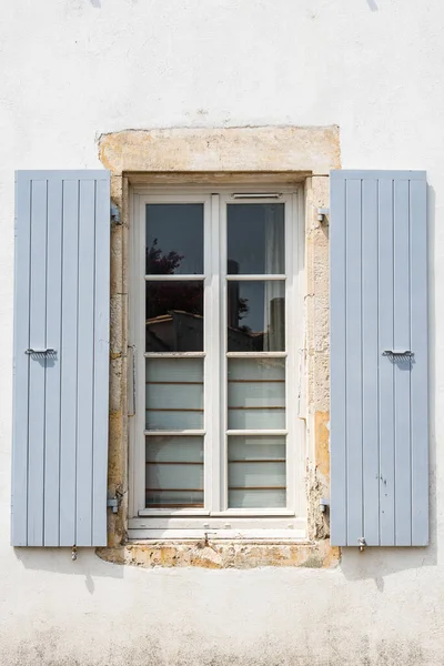 Old window with wooden gray painted shutters — Stock Photo, Image