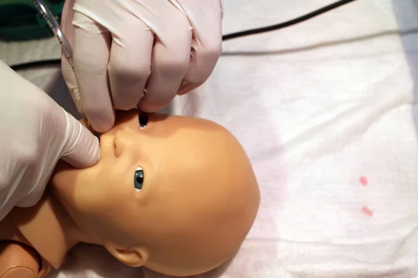 a medical manikin for a newborn that allows you to install a nasogastric tube and carry out artificial ventilation using an Ambu bag