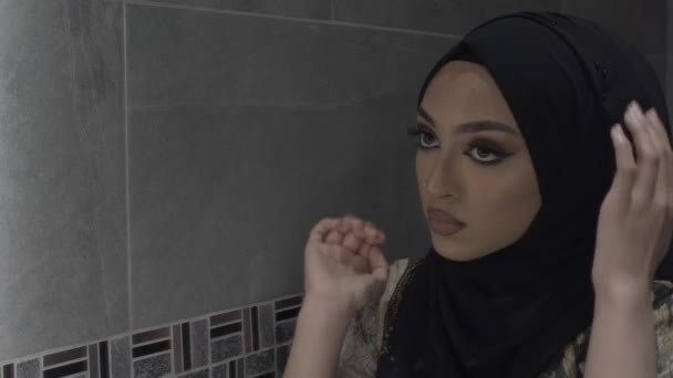 Young Muslim Woman Fixing Hijab Looking Mirror Locked — Stock Video