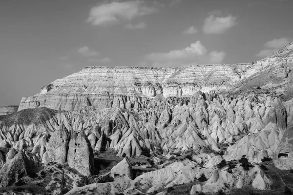 Beautiful black and white mountain landscape in Cappadocia Rose valley with big limestone hills, Turkey, Goreme