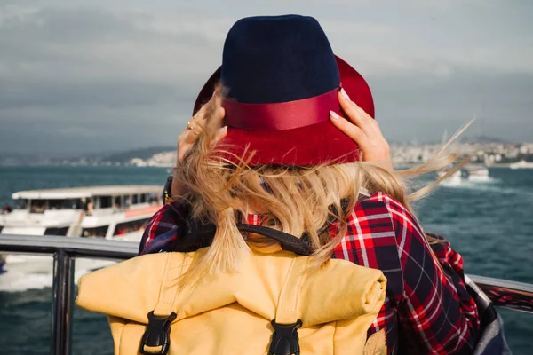 Turkey travel. Happy and positive beautiful woman on ferry at Istanbul through Bosporus strait