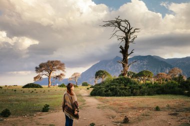 Woman enjoy hiking on lycian way in Turkey. Cirali beach and mountain
