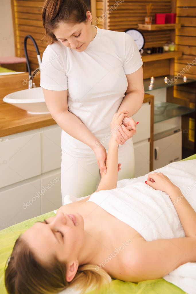 Woman having traditional hands and wrist massage