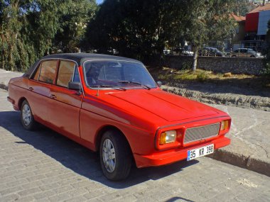 SOKE, TURKEY, 28 Ağustos 2013. Türk yapımı, kırmızı fiberglas gövdeli Anadol 4 kapılı sedan 1970-1975 yapımı.