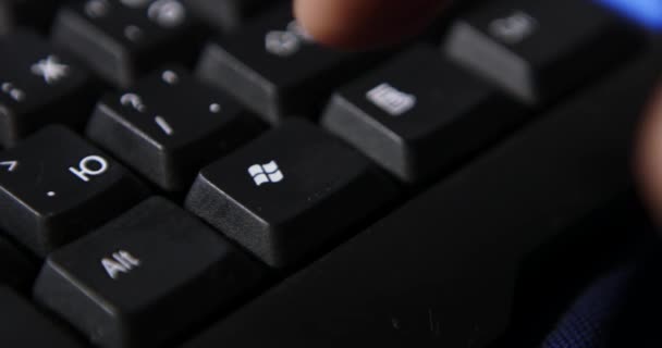 Hand Typing Black Keyboard White Table Blue Lights — Stock Video