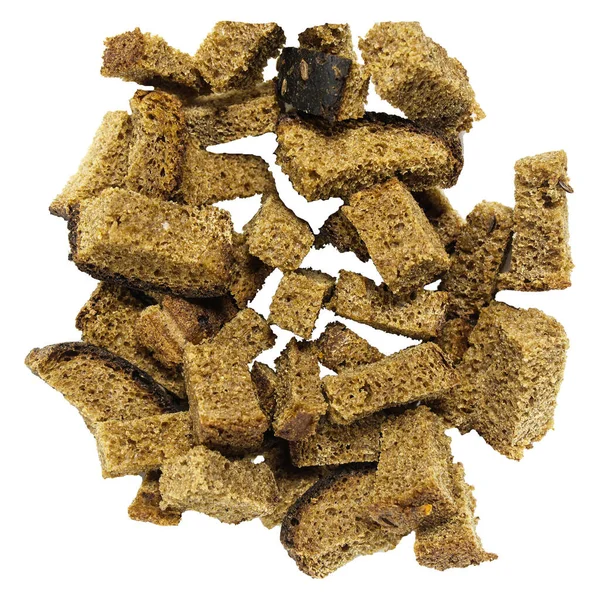 Pile of homemade rye bread croutons isolated on white background top view. Crispy bread cubes, dry rye crumbs, rusks, crouton or brown roasted crackers cube heap — Stock Image Pile Homemade Rye Bread Croutons Isolated White Background Top View Stock Photo