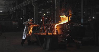 red-hot molten steel in a iron and steel enterprise production scene clipart