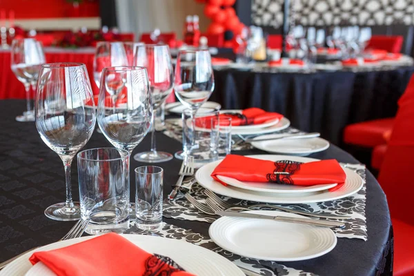 serving of the wedding table, beautiful festive decor in red