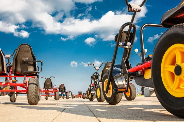 three-wheeled bike cars are in the Park on the asphalt