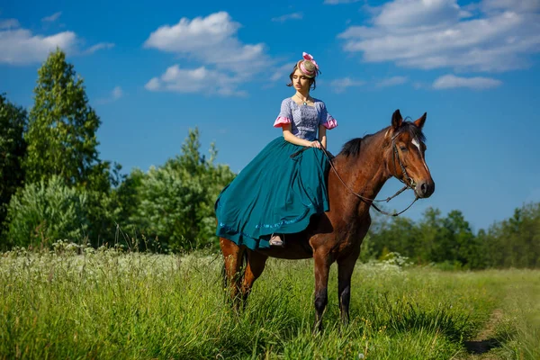 beautiful aristocrat in a dress on a horse