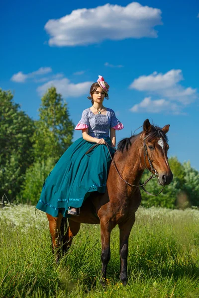 beautiful aristocrat in a dress on a horse