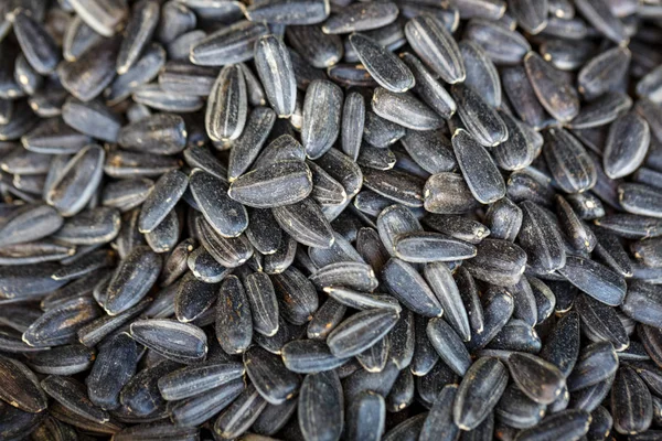 black sunflower seeds in a bag close-up.