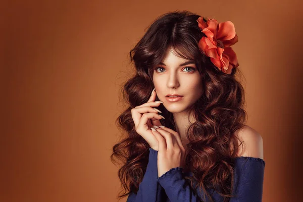 Young beautiful woman with flowers in her hair and  makeup, toning photo