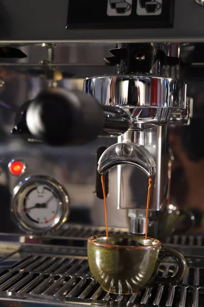 close up of coffee machine preparing cup of coffee