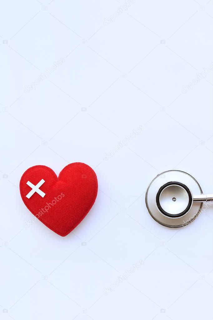 Red heart with stethoscope isolated on white background