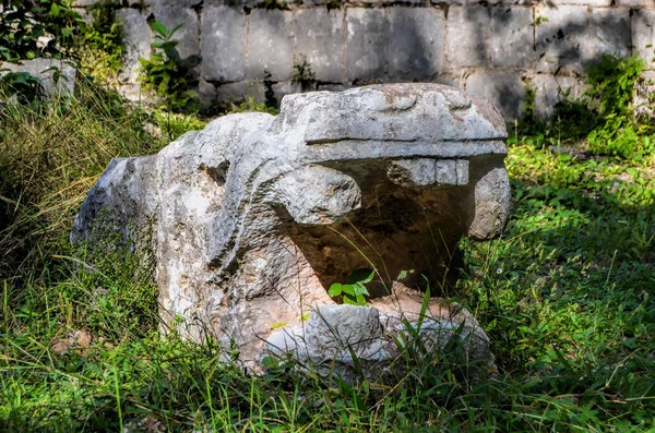 Jaguars head. Temple of Warriors and a group of a thousand columns in the ancient Mayan city of Chichen Itza.  Yucatan.  Mexico.