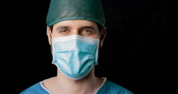 surgeon wearing face mask close-up portrait