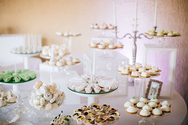 Appetizing sweet white cakes on glass plate