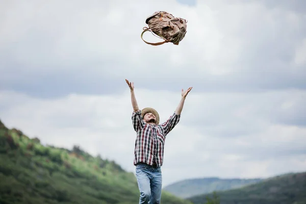 Young Male Tourist Throws His Backpack — Stock Photo, Image