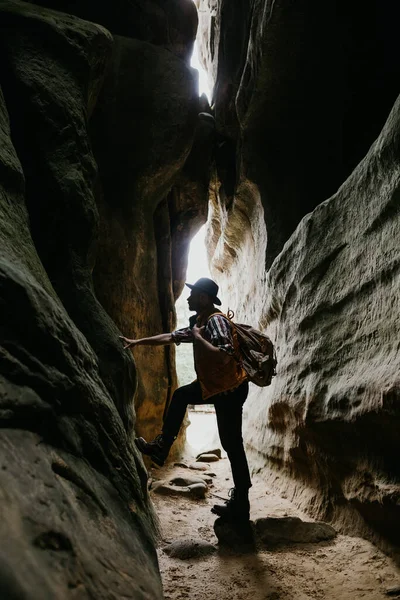 Amateur geologist and speleologist explores a mountain cave. Extreme hobbies