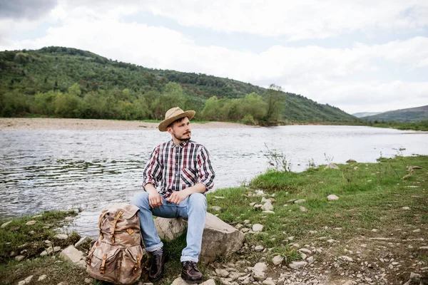 Young Male Traveler Resting River Bank Hard Walk — Stock Photo, Image