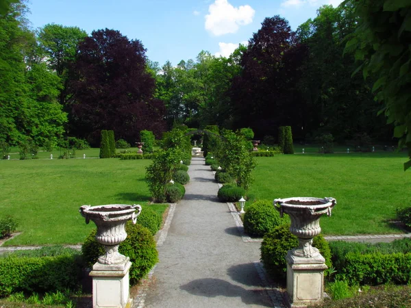 Baroque castle garden with stone flower container, french style park
