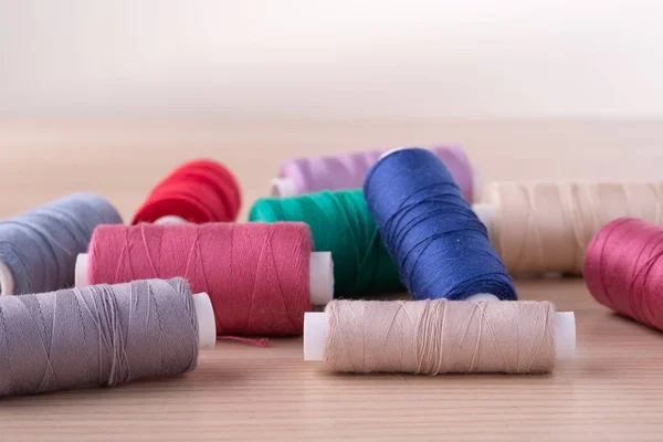 Angle View Scattered Colorful Cotton Thread Coils Wooden Table — Stock Photo, Image