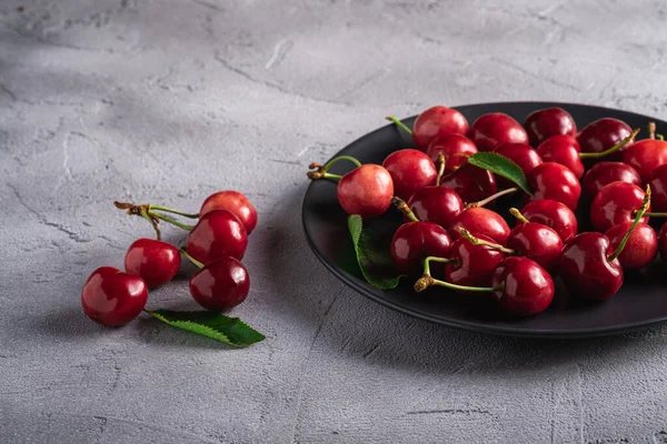 Fresh Ripe Cherry Fruits Green Leaves Black Plate Summer Vitamin — Stock Photo, Image