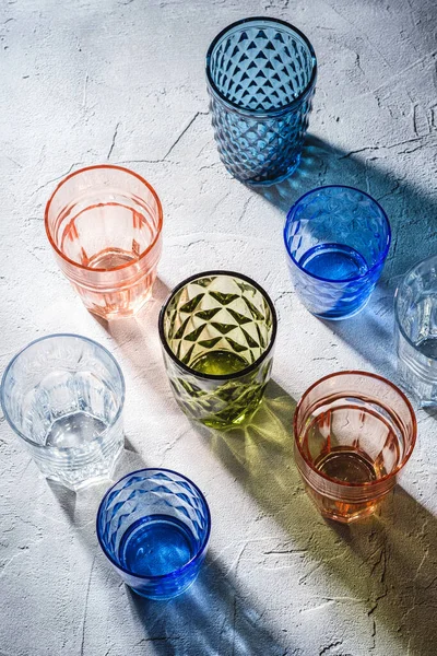 Colorful Faceted Geometric Drink Glass Group Empty Green Red Blue — Stock Photo, Image