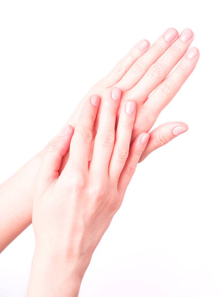 Beautiful female hands showing fresh cute manicure, skin and nail care concept, isolated