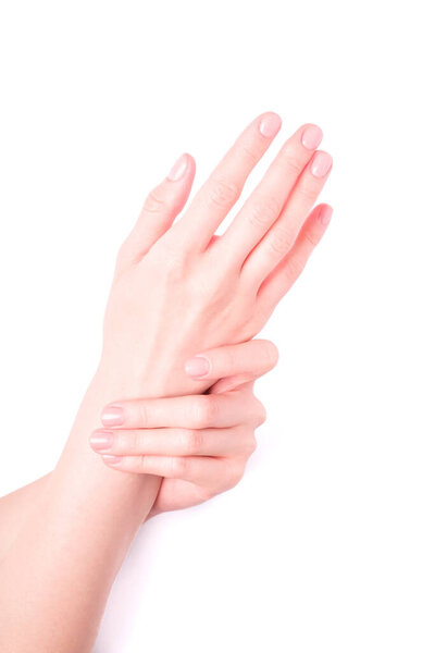 Beautiful female hands showing fresh cute manicure, skin and nail care concept, isolated