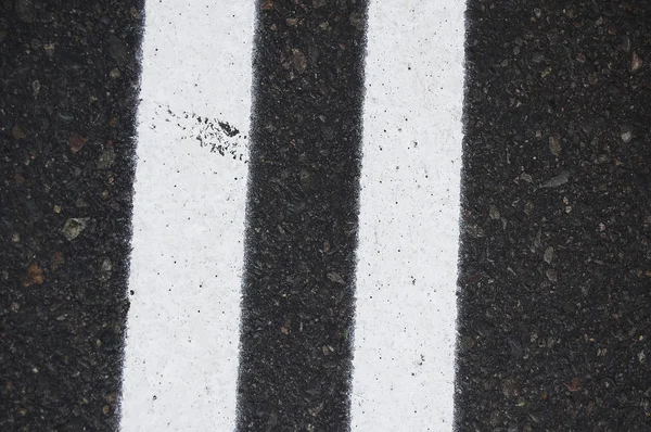 White stripes on asphalt road background — Stock Photo, Image