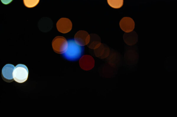 City lights blurred bokeh effect luminescence in the dark