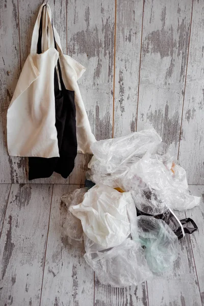 eco-friendly cotton shopping bags hanging vs many plastic bags o