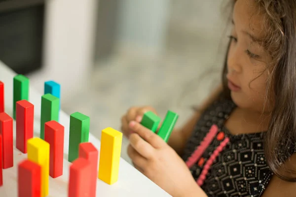 kazakh pretty little girl playing in kids development center