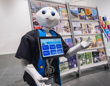 TOKYO, JAPAN - APR 13, 2018 : Pepper Robot Humanoid Assistant with Information screen Tokyo Tourist information center clipart
