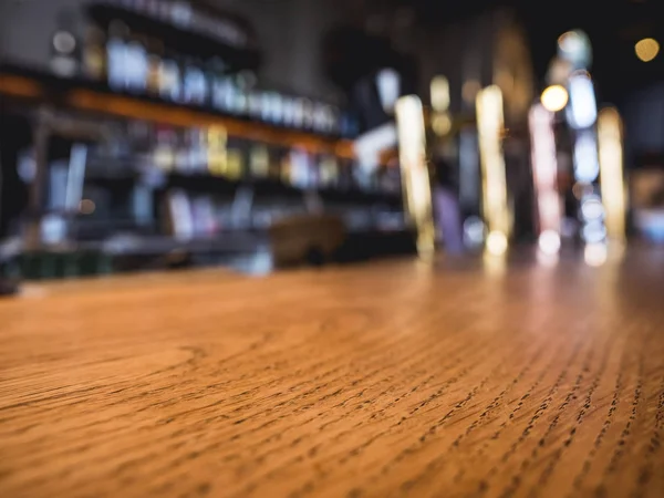 Table top counter Bar with Beer tap Blur shelf Party background — Stock Photo, Image