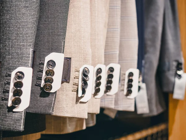 Suit on hangers Man Fashion Apparel store collection — Stock Photo, Image