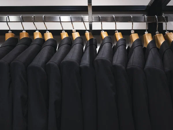 Suit on hangers Man Fashion Apparel store collection — Stock Photo, Image